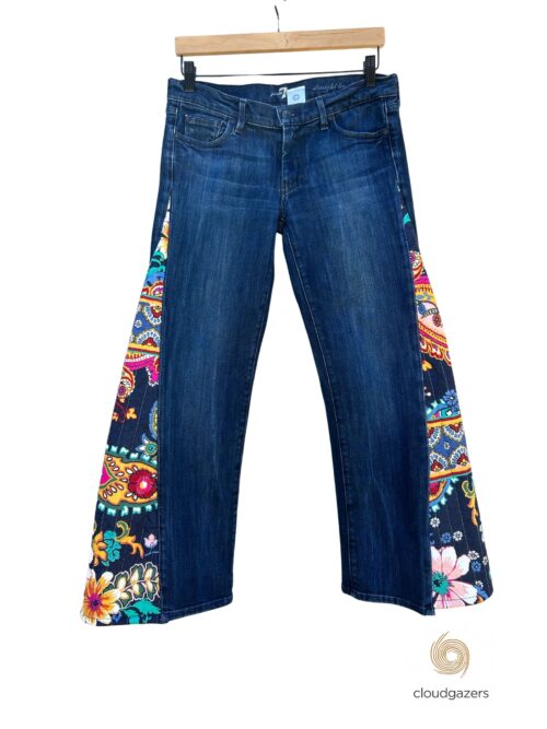 Flare Jeans with Floral Panels feature dark wash denim and colorful floral patchwork made from upcycled quilts.