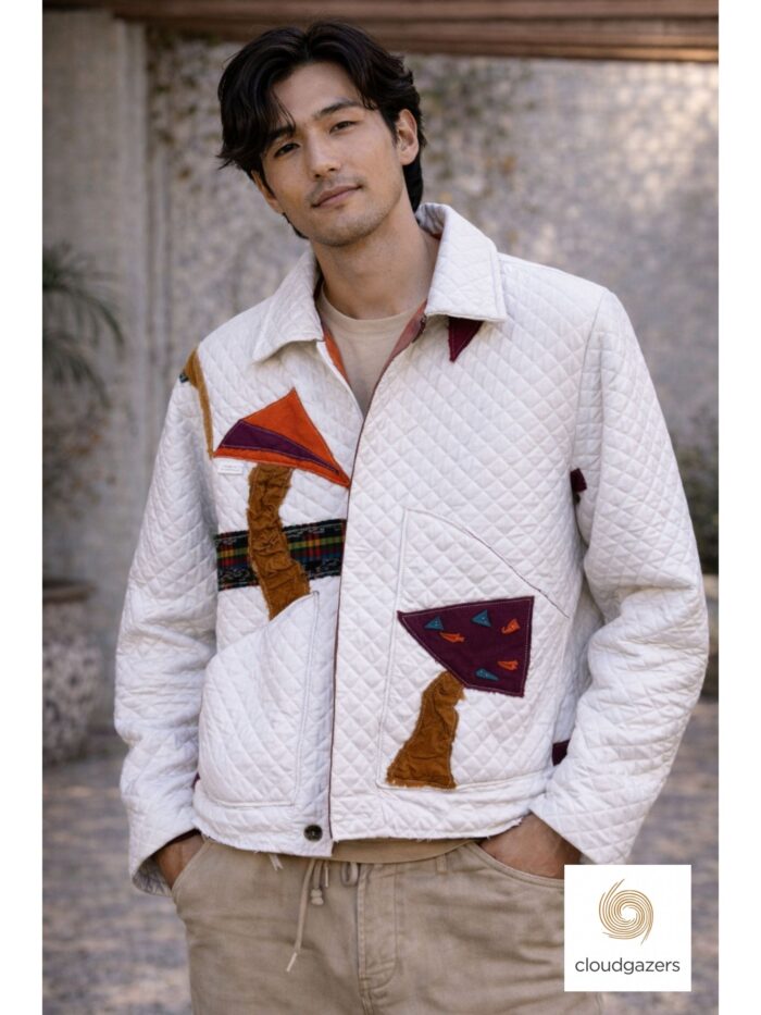 Re-imagined Quilted Statement Jacket featuring ivory quilted fabric and bold burgundy, orange, and teal appliqué details.