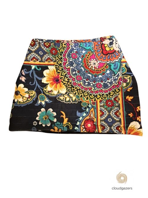 Embroidered Mandala Muse Mini Skirt features bold floral embroidery in vibrant colors on a black background.