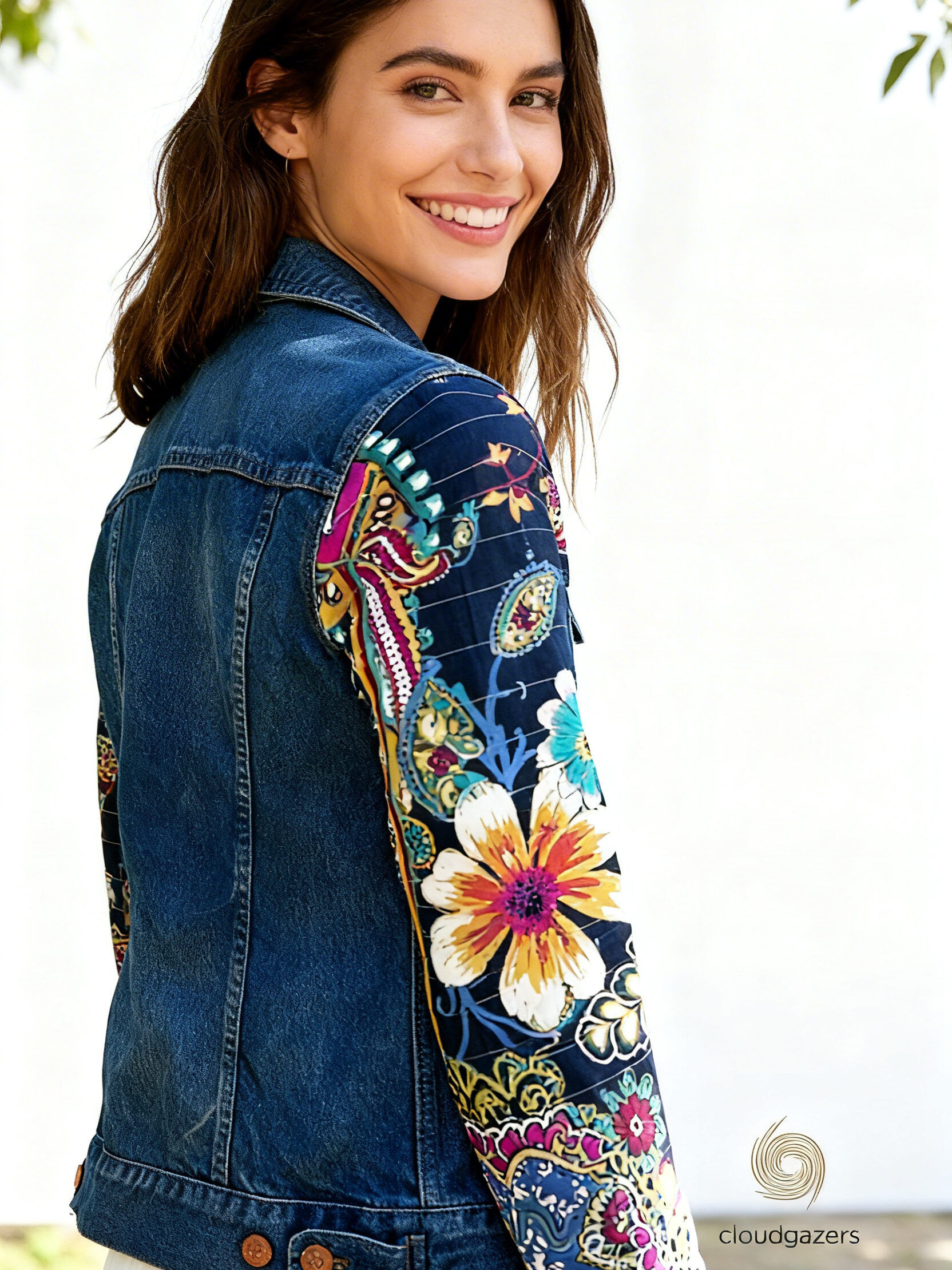 Denim Jacket with Handmade Floral Sleeves features a classic blue denim body with colorful quilted floral sleeves.