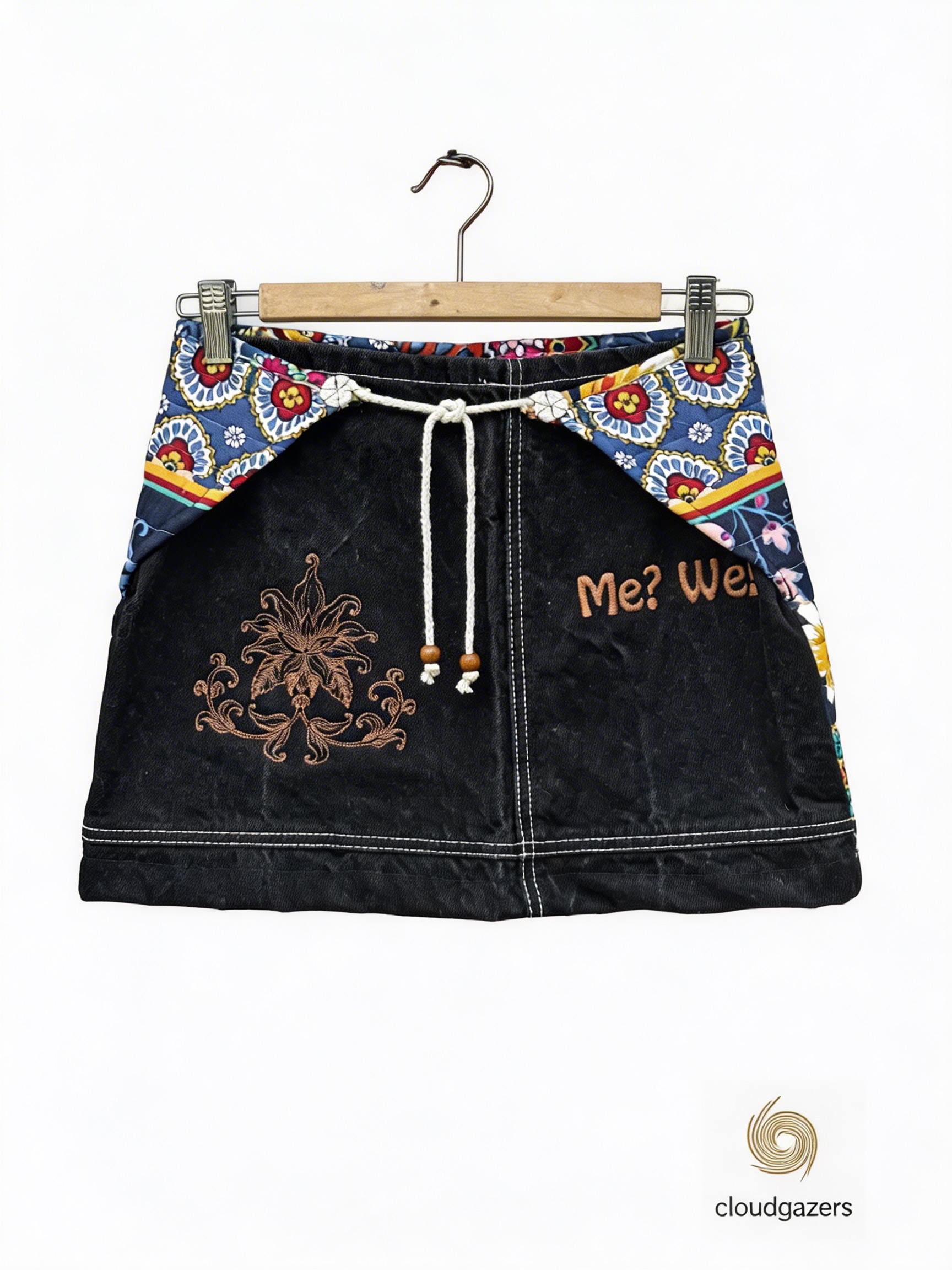 Embroidered Colorblock Mini Skirt featuring quilted floral panels, black denim, and a drawstring waist in a unique design.