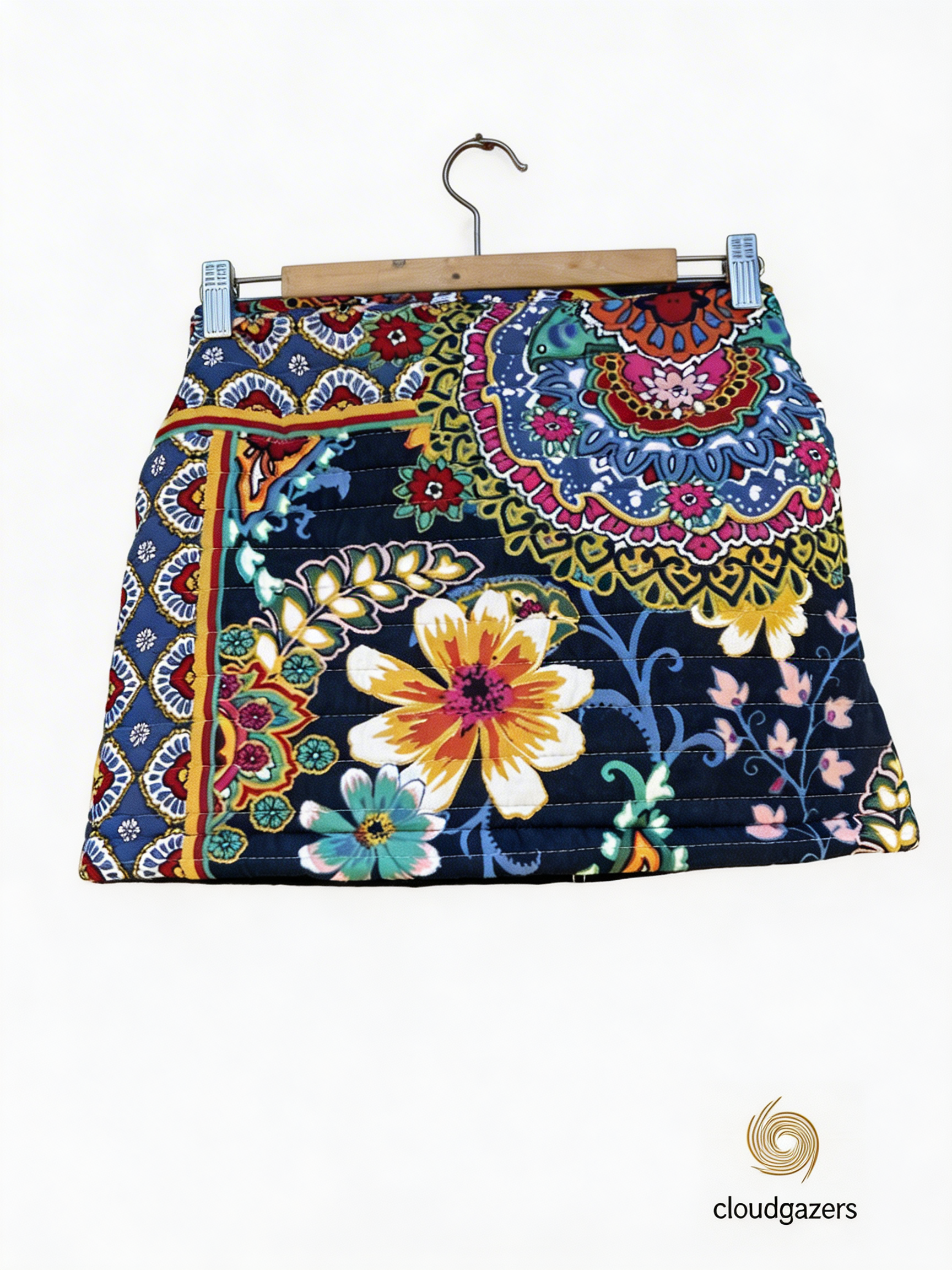 Reversible Mini Skirt with floral front, black denim back, featuring an adjustable rope tie, showcasing handmade clothing.