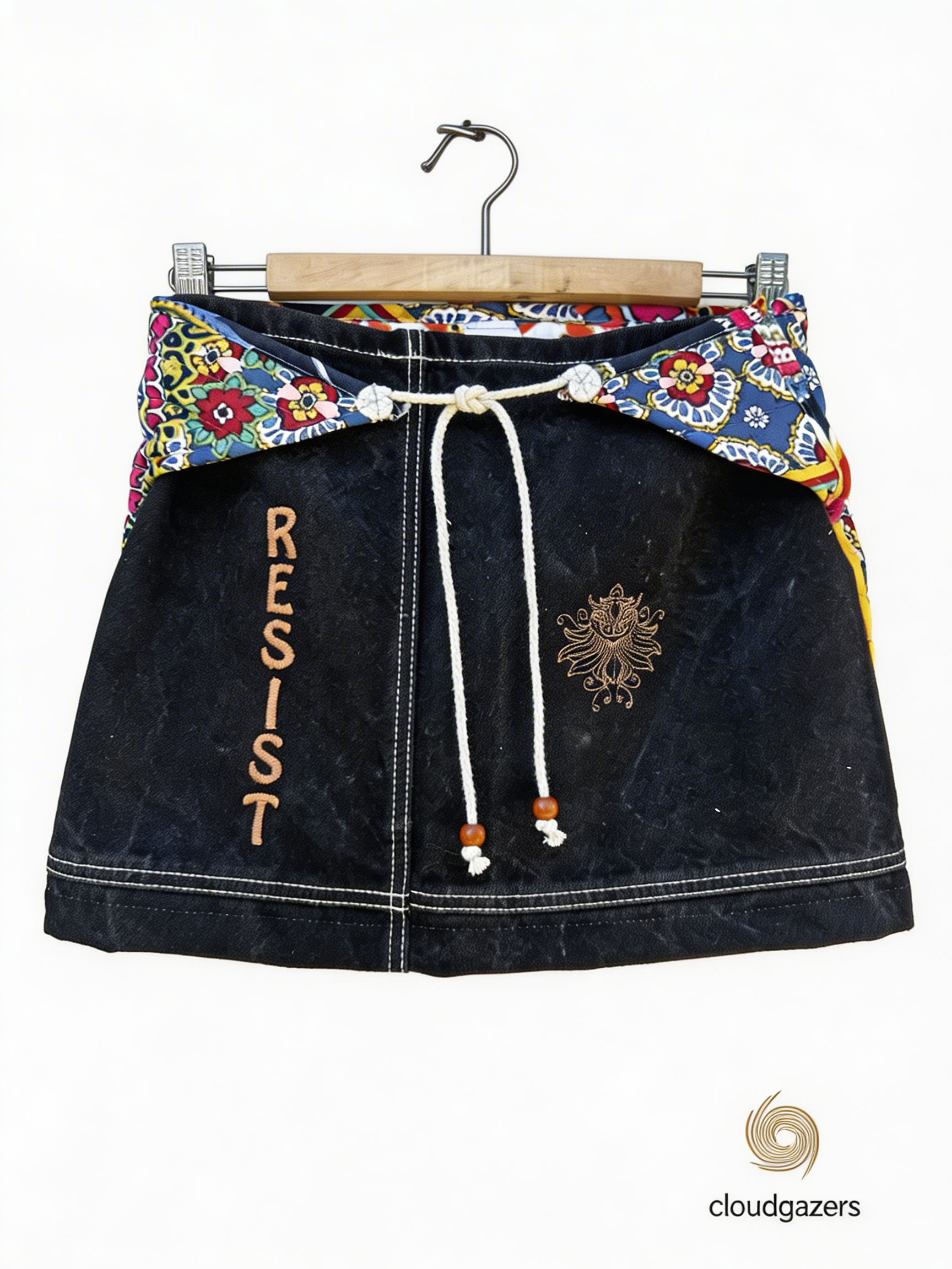Reversible Mini Skirt with floral front, black denim back, adjustable rope tie, showcasing handmade conscious fashion.