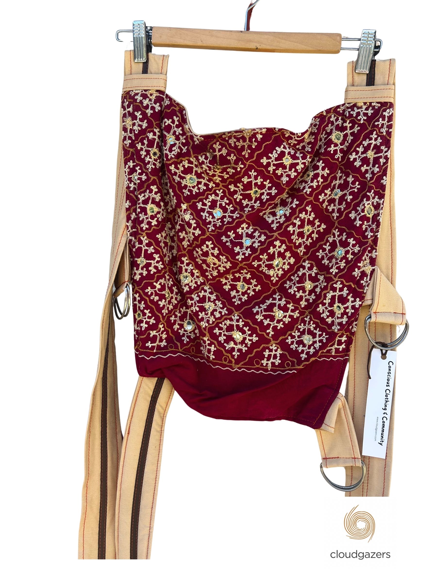 Handmade Baby Carrier One-of-One by Cloudgazers with vibrant red and gold pattern, featuring adjustable straps and unique design.