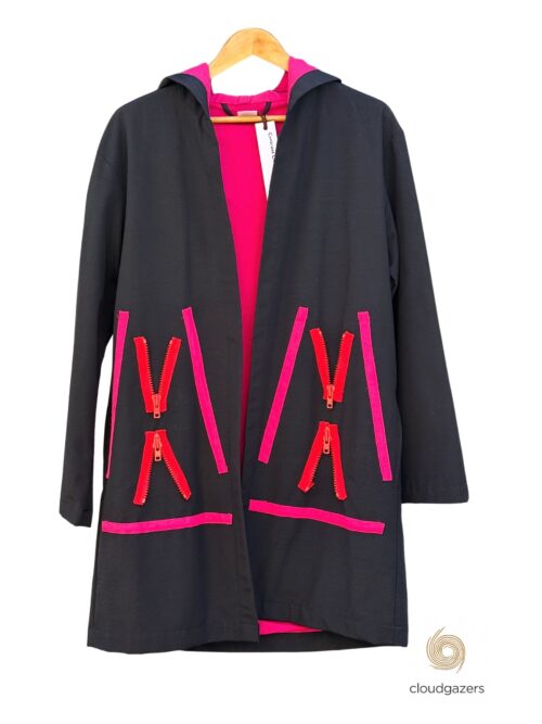 Unisex Hooded Jacket with Zippers in black, featuring bold hot pink zippers and lining, showcasing sustainable fashion craftsmanship.